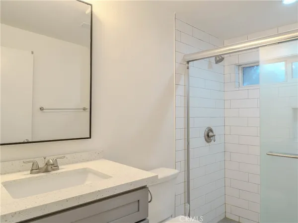 a bathroom with a sink and mirror