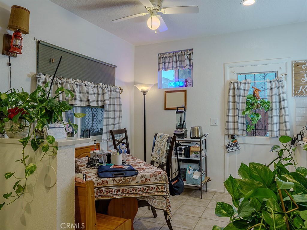 9413 Garfield Street Riverside, CA 92503 - Photo 31 of 33 a workspace with furniture and potted plant