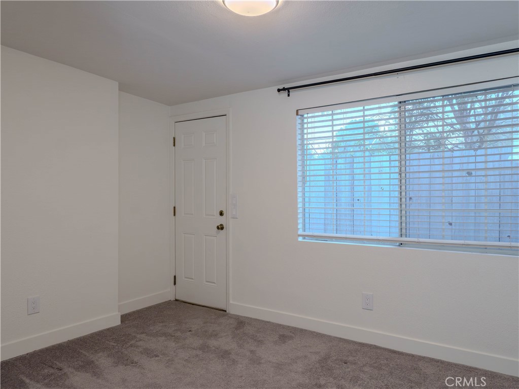 9413 Garfield Street Riverside, CA 92503 - Photo 10 of 19 a view of an empty room with a window