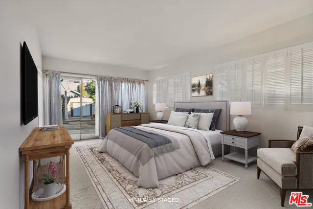 a bedroom with furniture and a bed