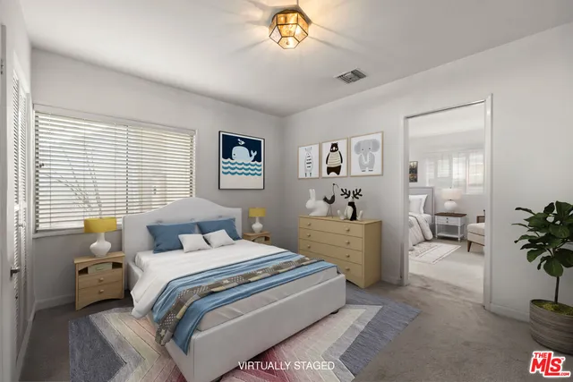 a bedroom with furniture and a window