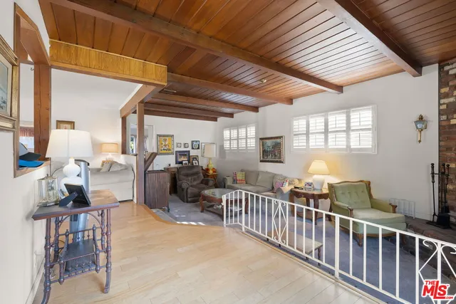 a view of a livingroom with furniture and windows