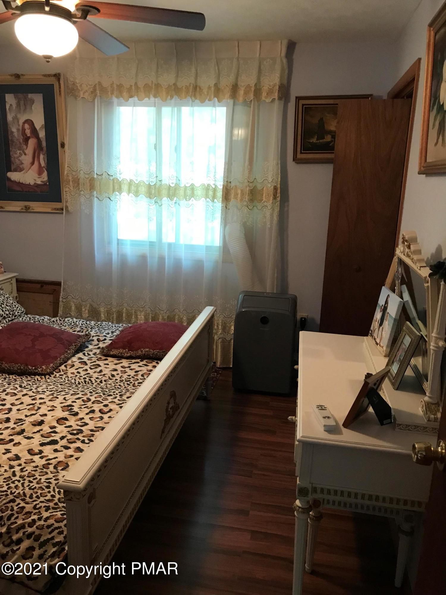 716 Dundee Road Bushkill, PA 18324 - Photo 26 of 38 a room with furniture and window