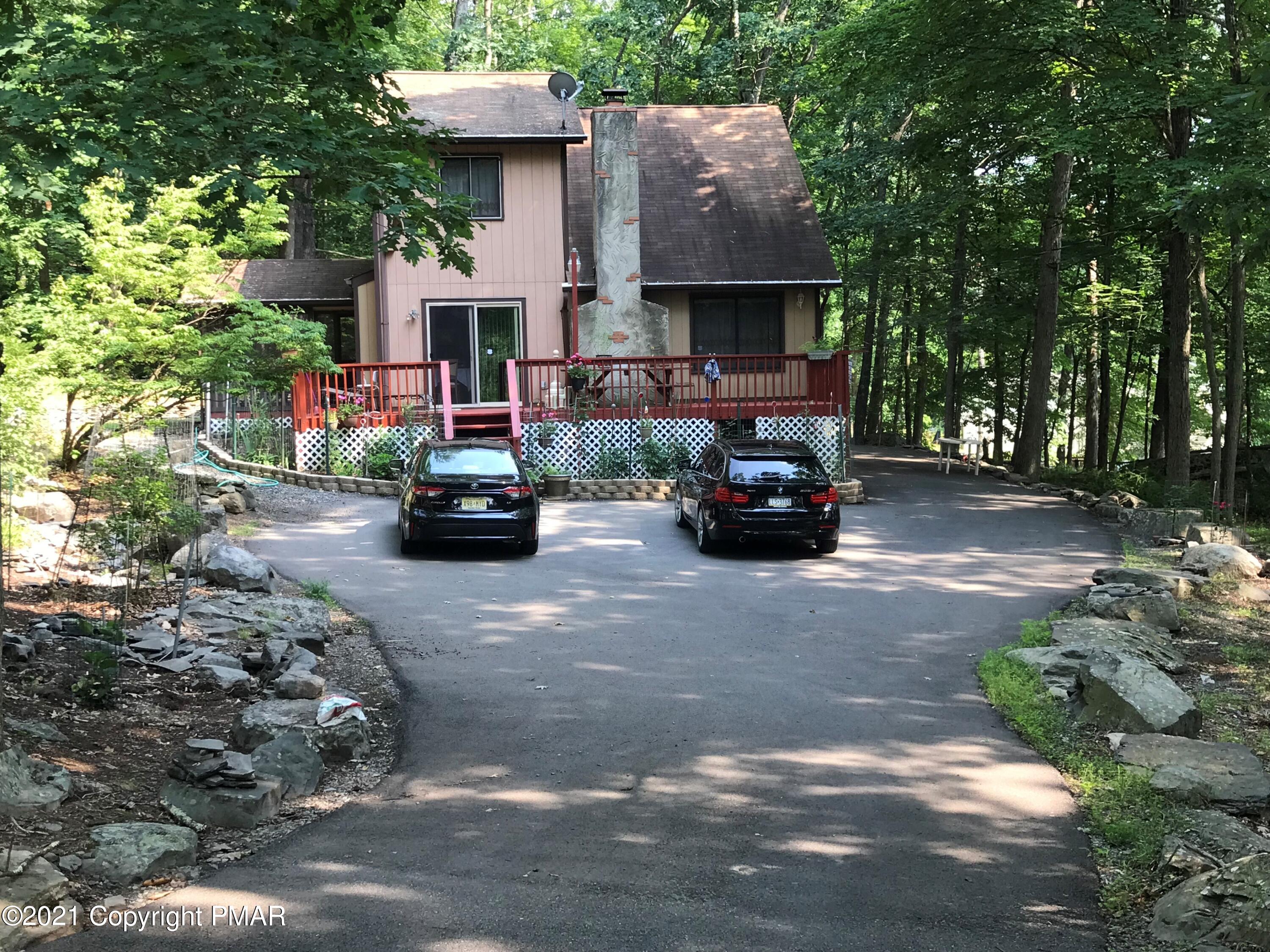 716 Dundee Road Bushkill, PA 18324 - Photo 3 of 38 a car parked in front of a house