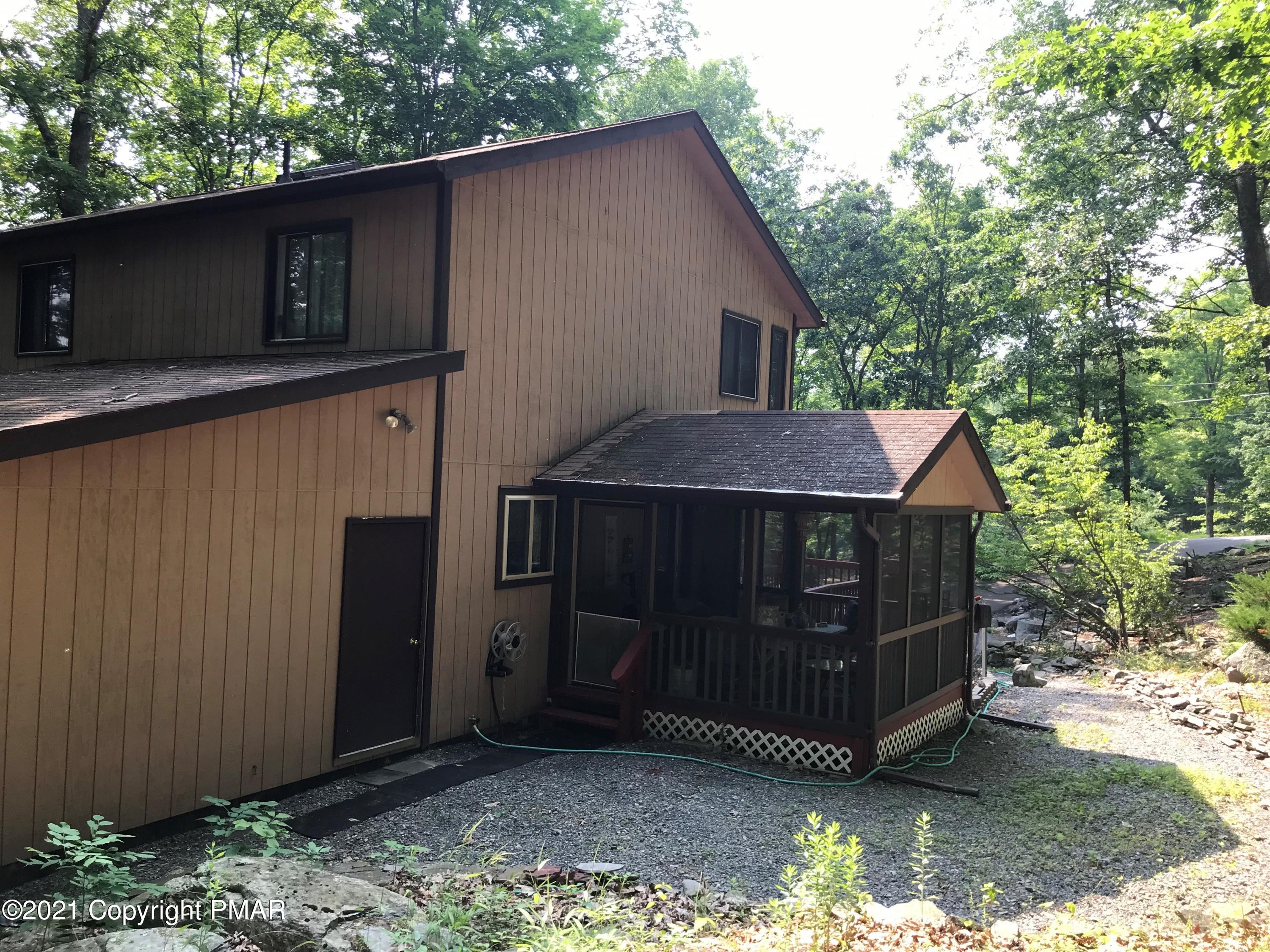 716 Dundee Road Bushkill, PA 18324 - Photo 6 of 38 a view of backyard of house with wooden fence