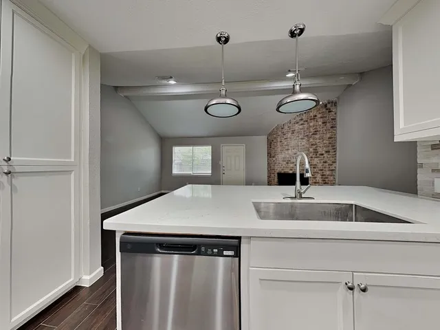 a kitchen with a table and chairs