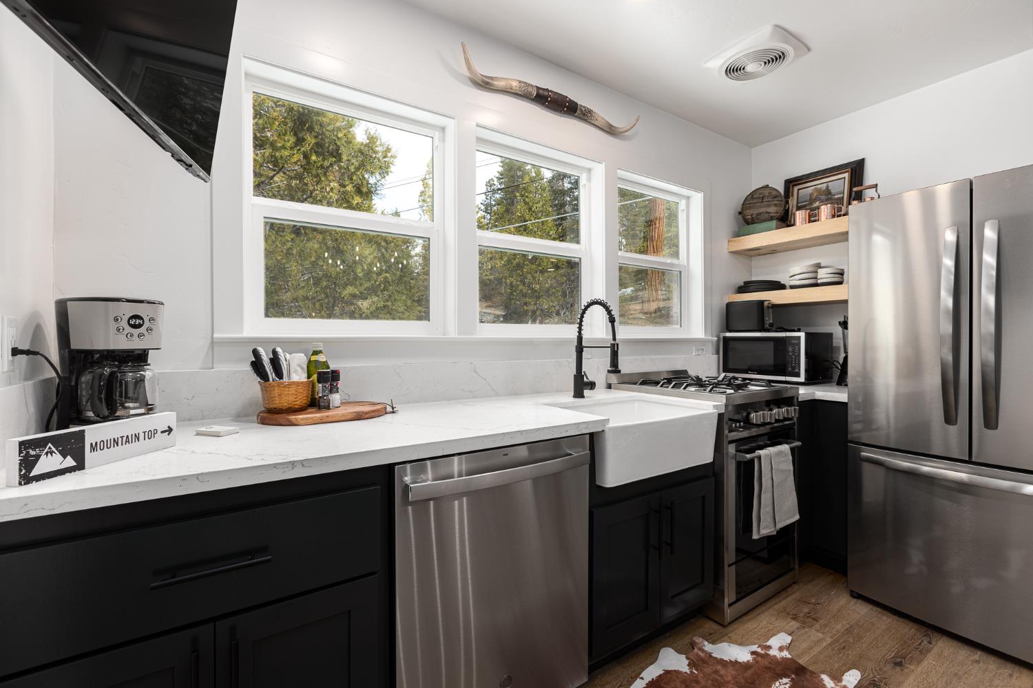 42145 Tollhouse Road Shaver Lake, CA 93664 - Photo 12 of 22 a kitchen with a sink stove and refrigerator