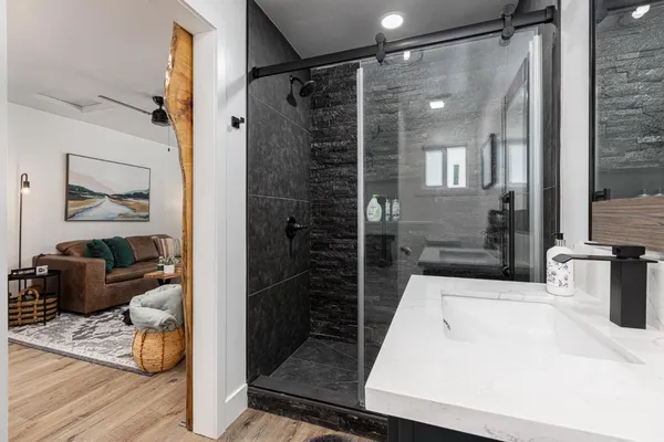 a bathroom with a tub and a shower