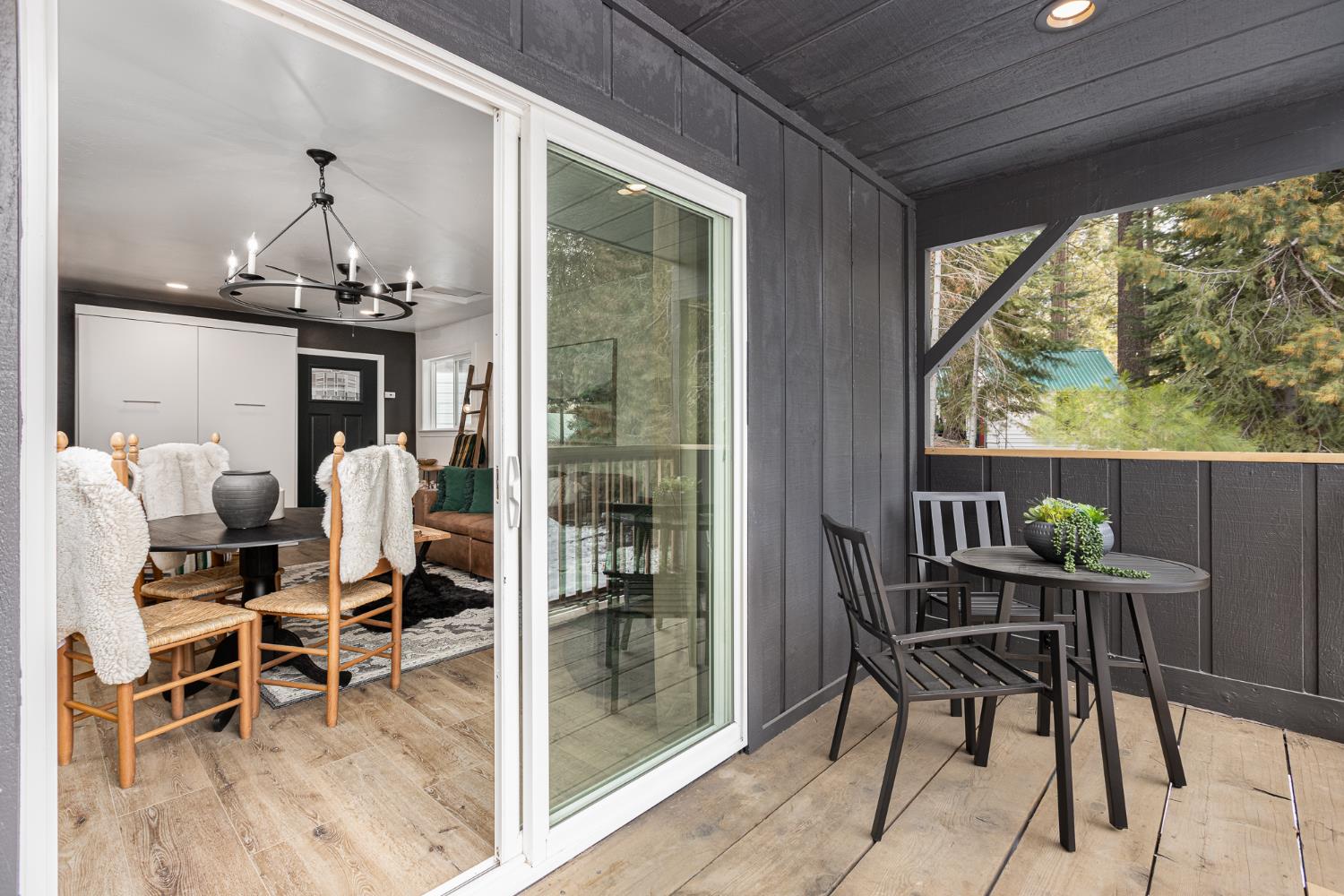 42145 Tollhouse Road Shaver Lake, CA 93664 - Photo 16 of 22 a dining room with furniture a chandelier and window