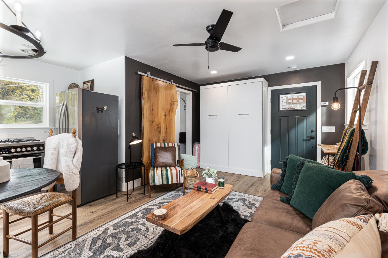 42145 Tollhouse Road Shaver Lake, CA 93664 - Photo 18 of 22 a living room with furniture and a window