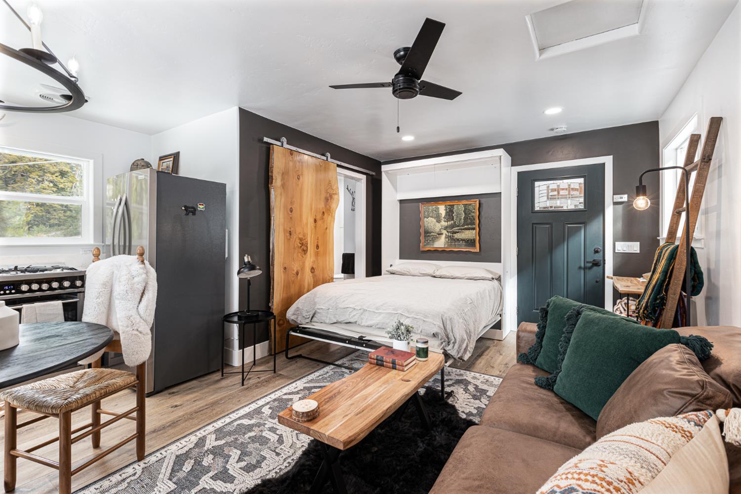 42145 Tollhouse Road Shaver Lake, CA 93664 - Photo 19 of 22 a bed room with furniture and a window