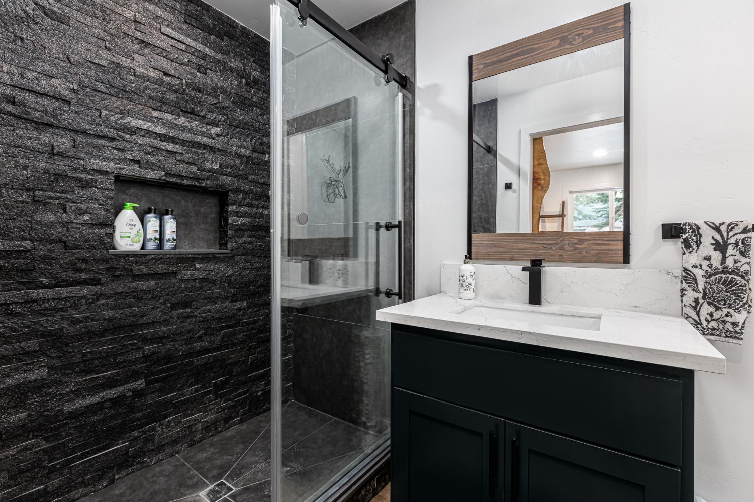 42145 Tollhouse Road Shaver Lake, CA 93664 - Photo 6 of 22 a bathroom with a sink and a mirror