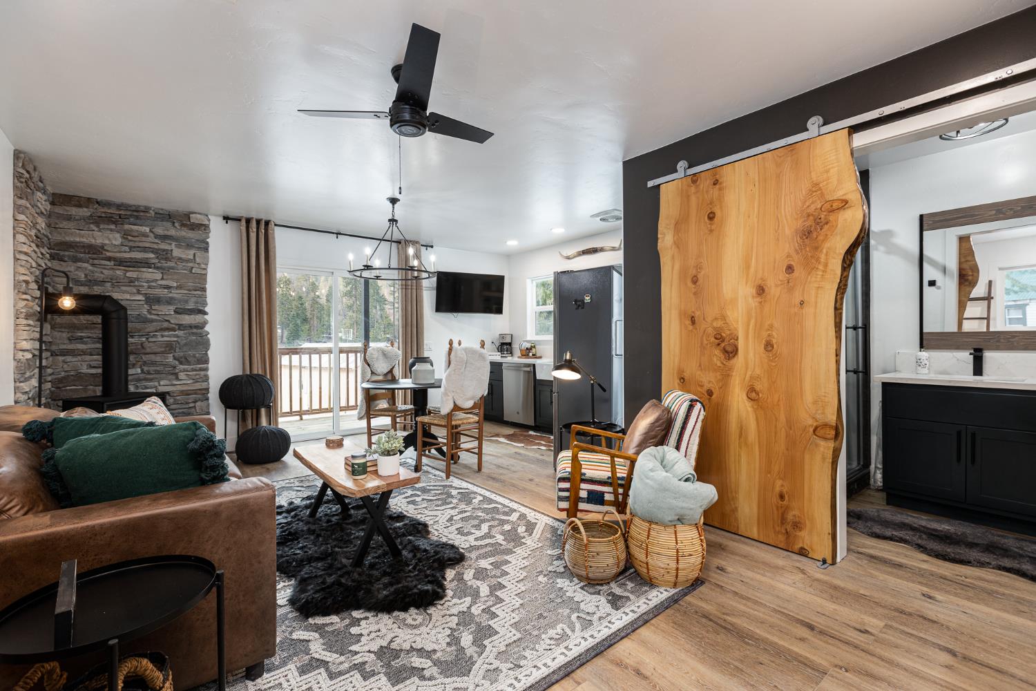 42145 Tollhouse Road Shaver Lake, CA 93664 - Photo 7 of 22 a living room with furniture or couch and a large window