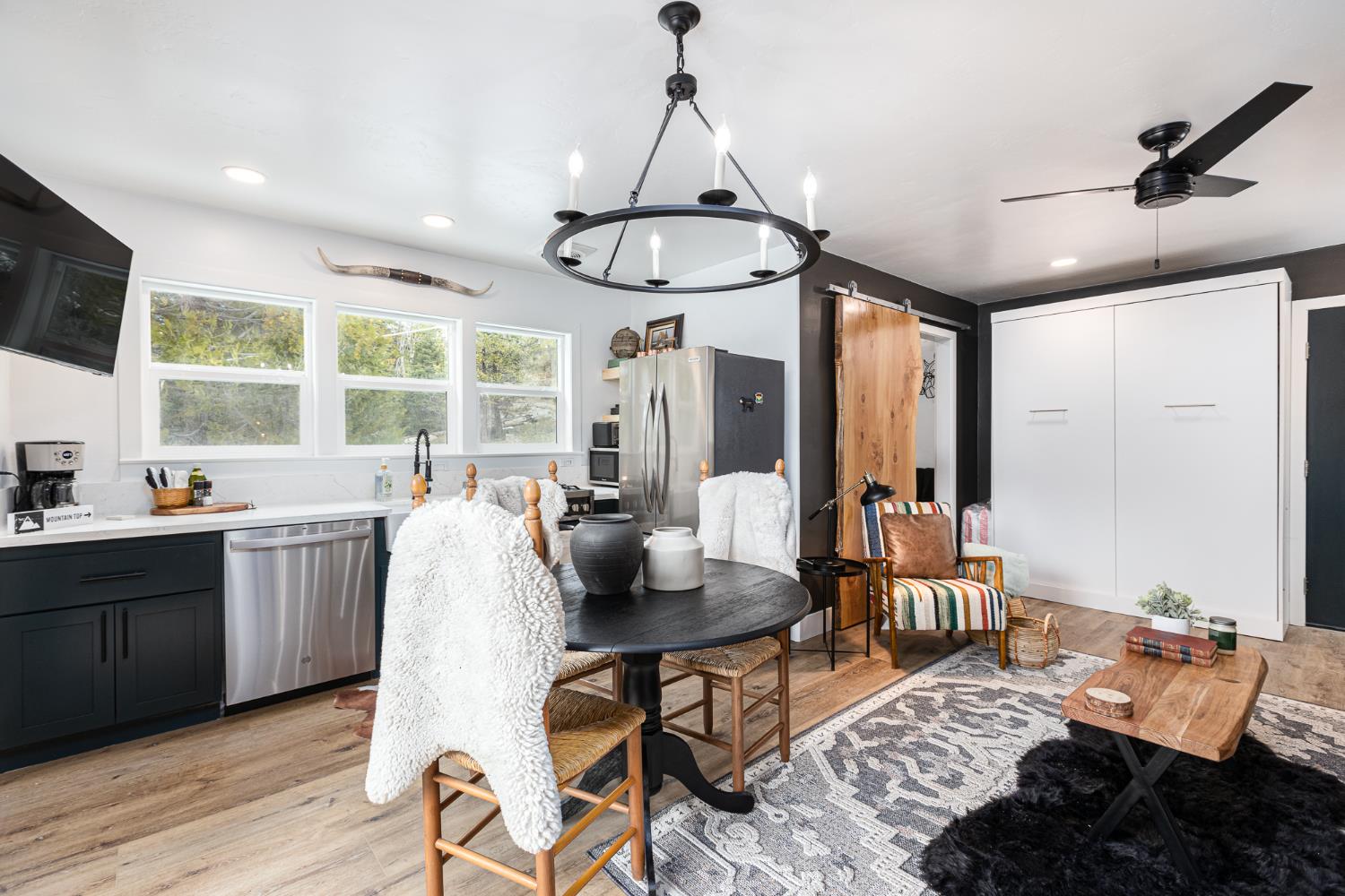 42145 Tollhouse Road Shaver Lake, CA 93664 - Photo 10 of 22 a living room with furniture and a chandelier