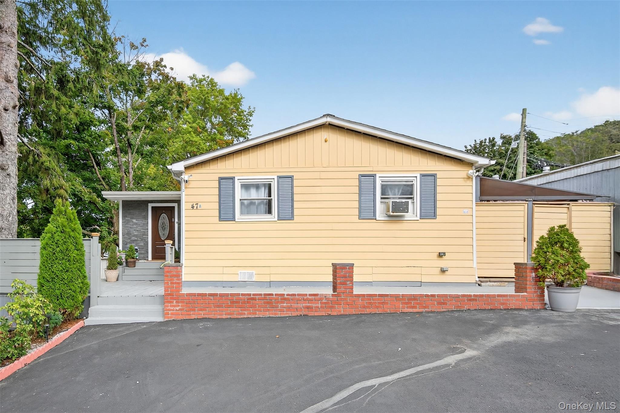 a front view of a house with garage