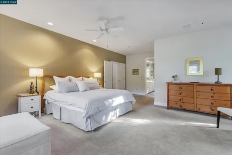 a bed room with a bed and a dresser