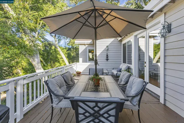 a view of an outdoor sitting area with furniture