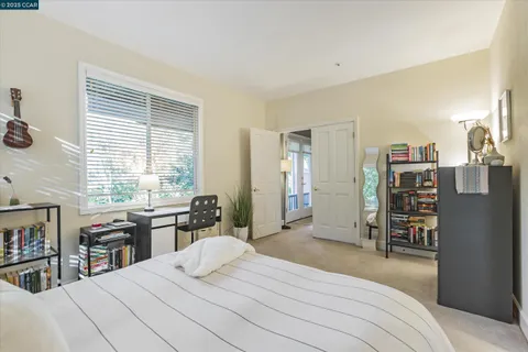a bedroom with a bed and a cabinets