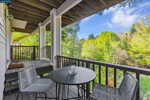 a view of a balcony with furniture