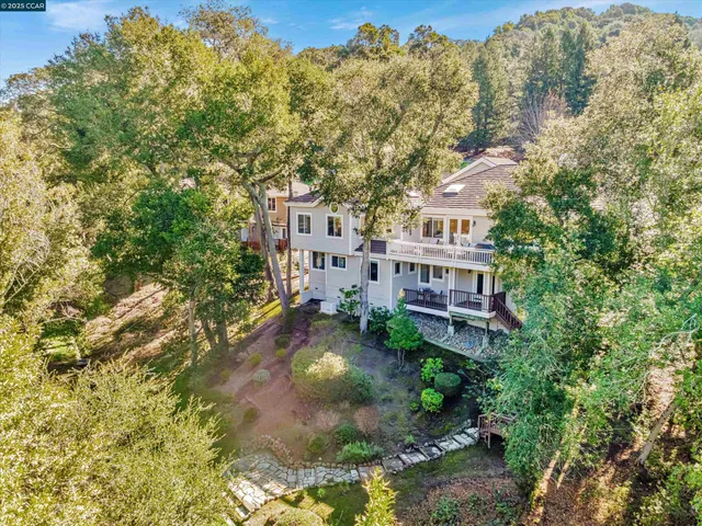 a aerial view of a house with a yard