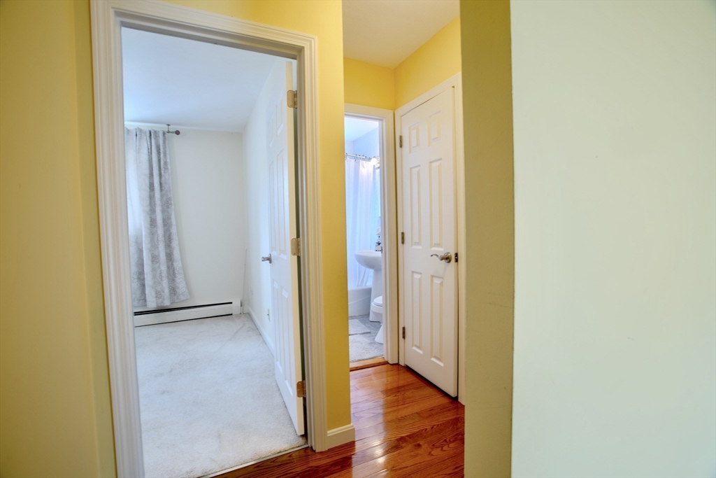 15 Westgate Road, Unit 6 Chestnut Hill, MA 02467 - Photo 13 of 20 a view of a hallway with wooden floor