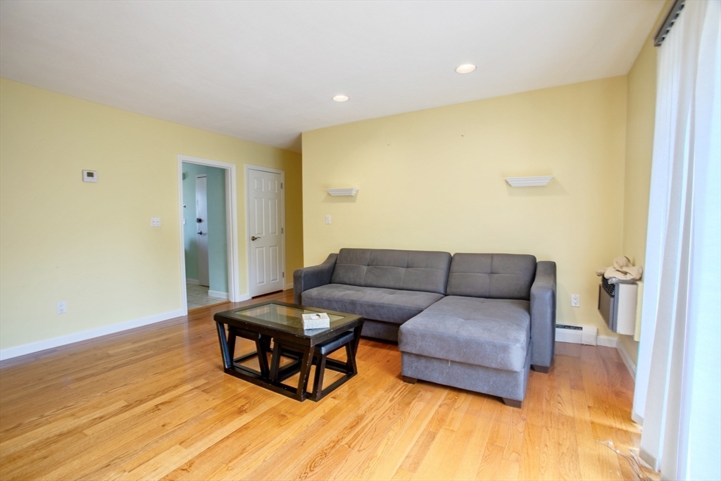 15 Westgate Road, Unit 6 Chestnut Hill, MA 02467 - Photo 4 of 20 a living room with furniture and a wooden floor