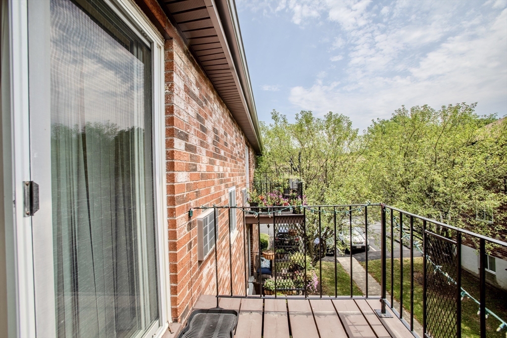 15 Westgate Road, Unit 6 Chestnut Hill, MA 02467 - Photo 7 of 20 a view of balcony with wooden floor