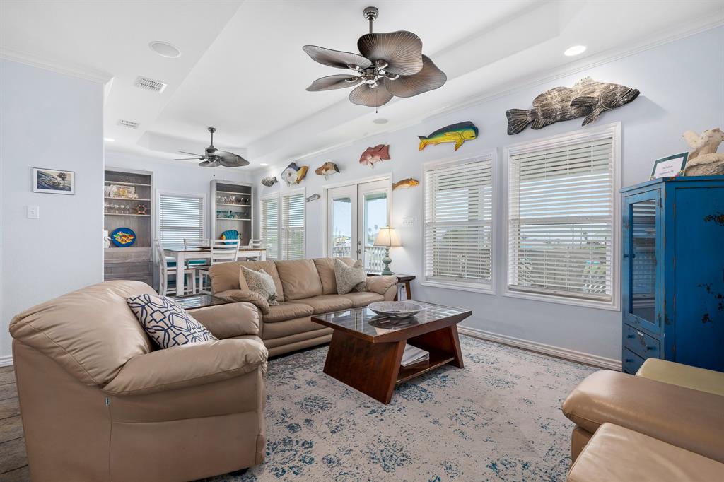 515 Copano Cove Road Rockport, TX 78382 - Photo 14 of 39 a living room with furniture ceiling fan and a window
