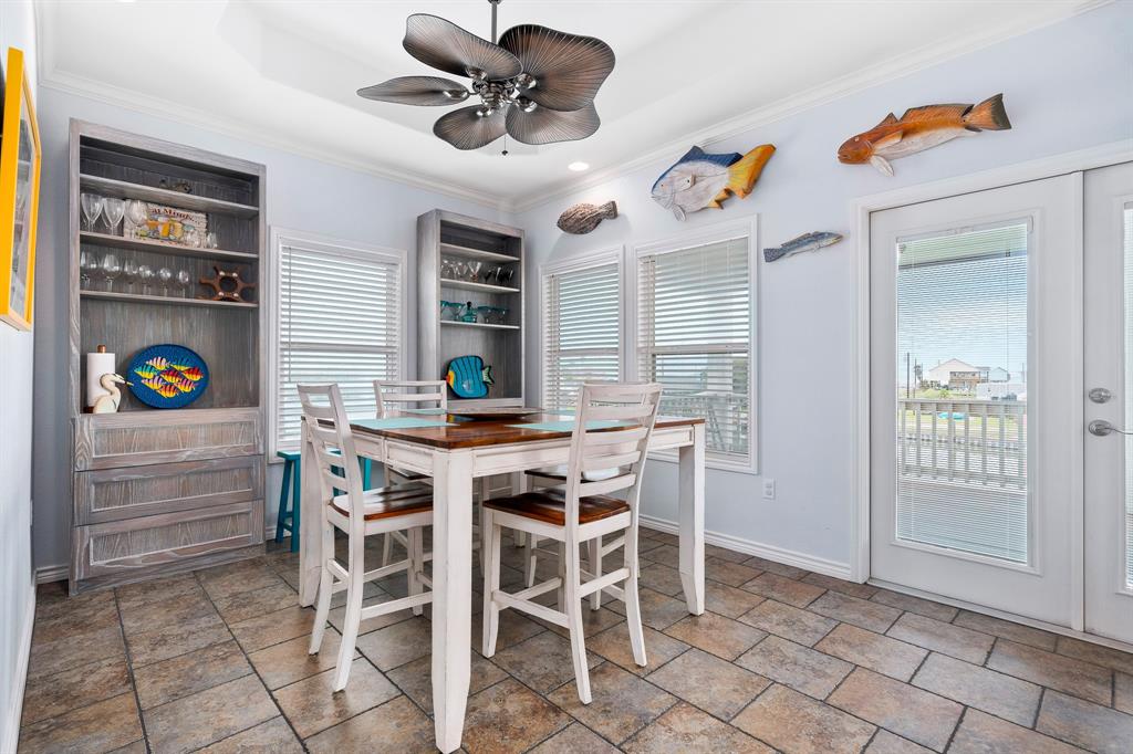515 Copano Cove Road Rockport, TX 78382 - Photo 15 of 39 a view of a dining room with furniture and a chandelier