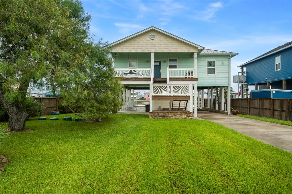 515 Copano Cove Road Rockport, TX 78382 - Photo 2 of 39 a front view of a house with a garden