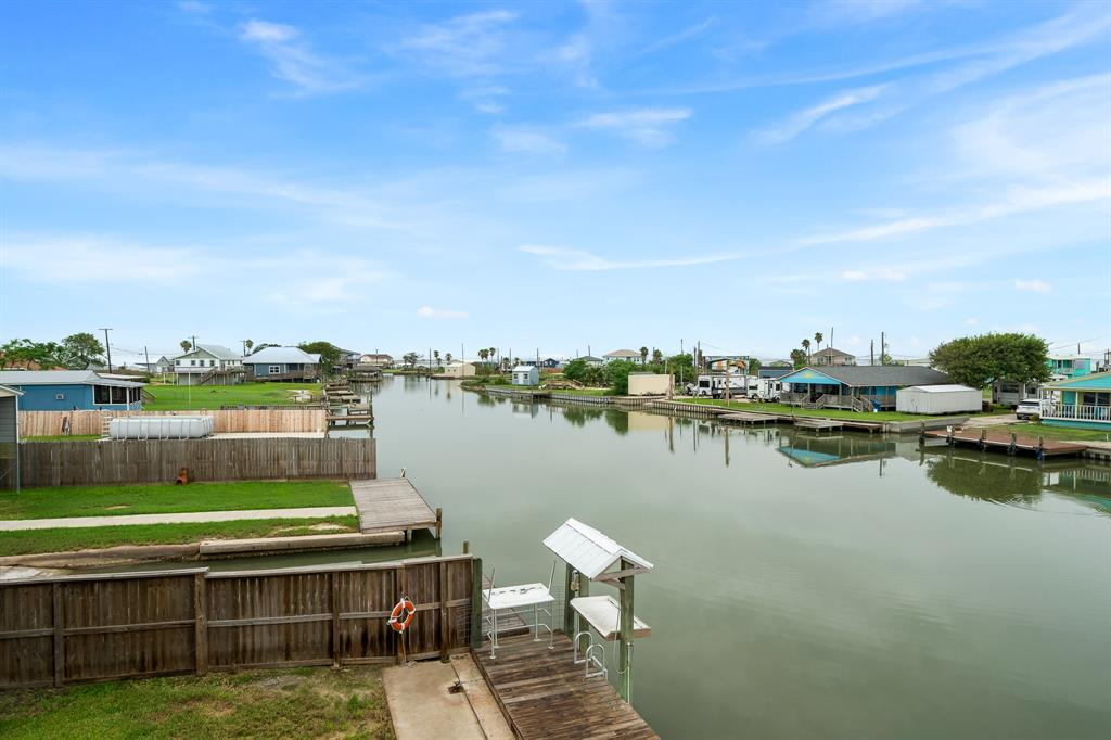 515 Copano Cove Road Rockport, TX 78382 - Photo 27 of 39 a view of a lake with houses in the back