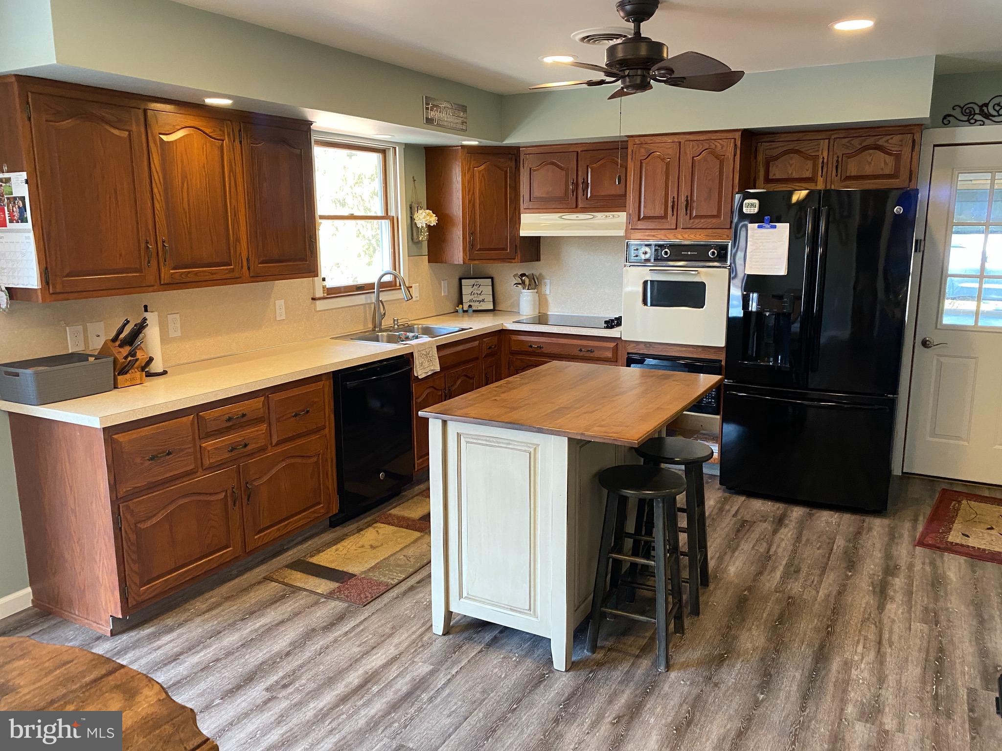 424 Pine Grove Road Nottingham, PA 19362 - Photo 21 of 60 Kitchen with island and new vinyl plank flooring