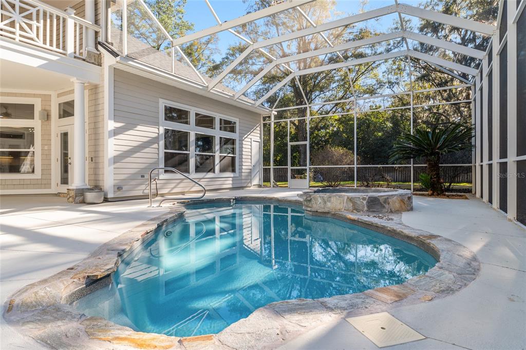 10614 Southwest 15th Lane Gainesville, FL 32607 - Photo 74 of 85 a view of a swimming pool with a patio