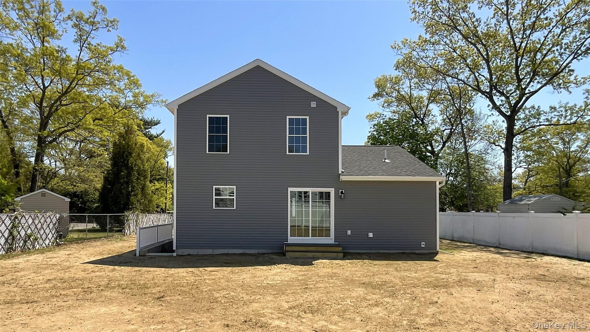 492 Blue Point Road Farmingville, NY 11738 - Photo 21 of 21 a view of a house with a yard