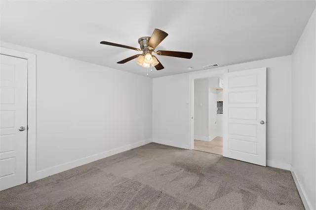 a view of a ceiling fan in a room