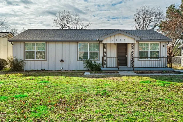 front view of a house with a yard