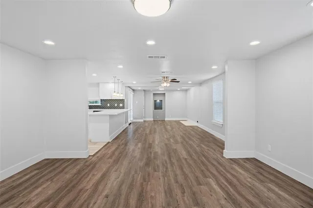 a view of a kitchen with a sink and a stove top oven