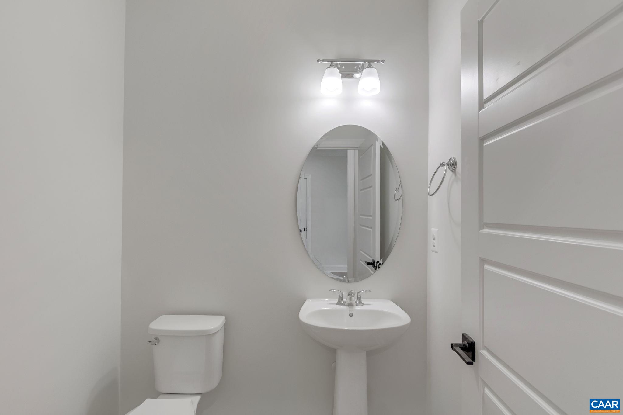 3012 Miranda Crossing Charlottesville, VA 22901 - Photo 12 of 57 a bathroom with a toilet a sink and mirror