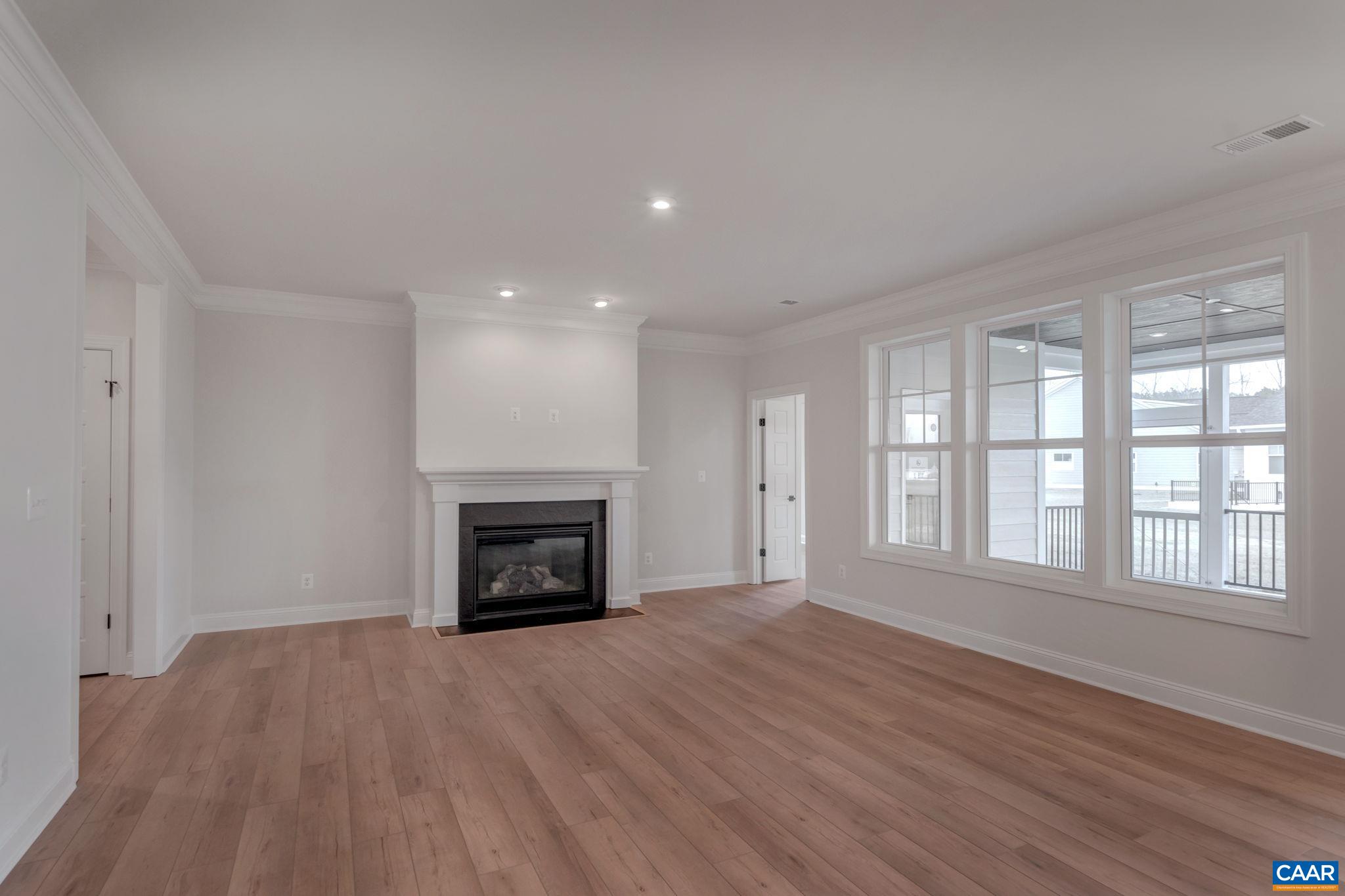 3012 Miranda Crossing Charlottesville, VA 22901 - Photo 23 of 57 wooden floor fireplace and windows in an empty room