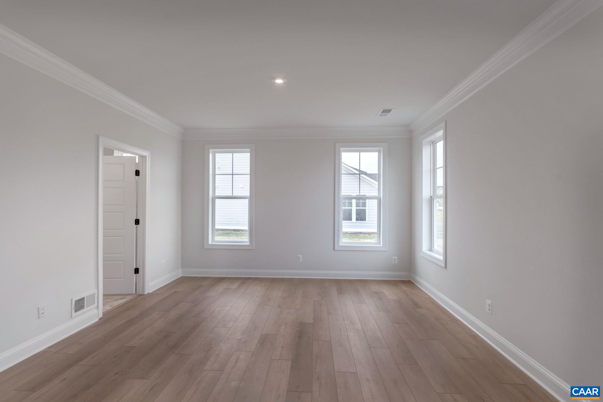 3012 Miranda Crossing Charlottesville, VA 22901 - Photo 29 of 57 wooden floor in an empty room with a window