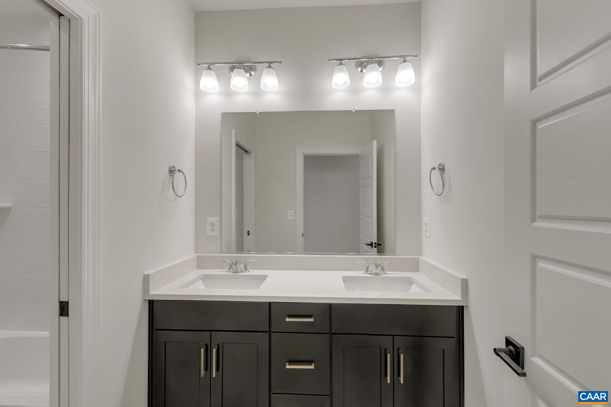 3012 Miranda Crossing Charlottesville, VA 22901 - Photo 40 of 57 a bathroom with a sink and a mirror
