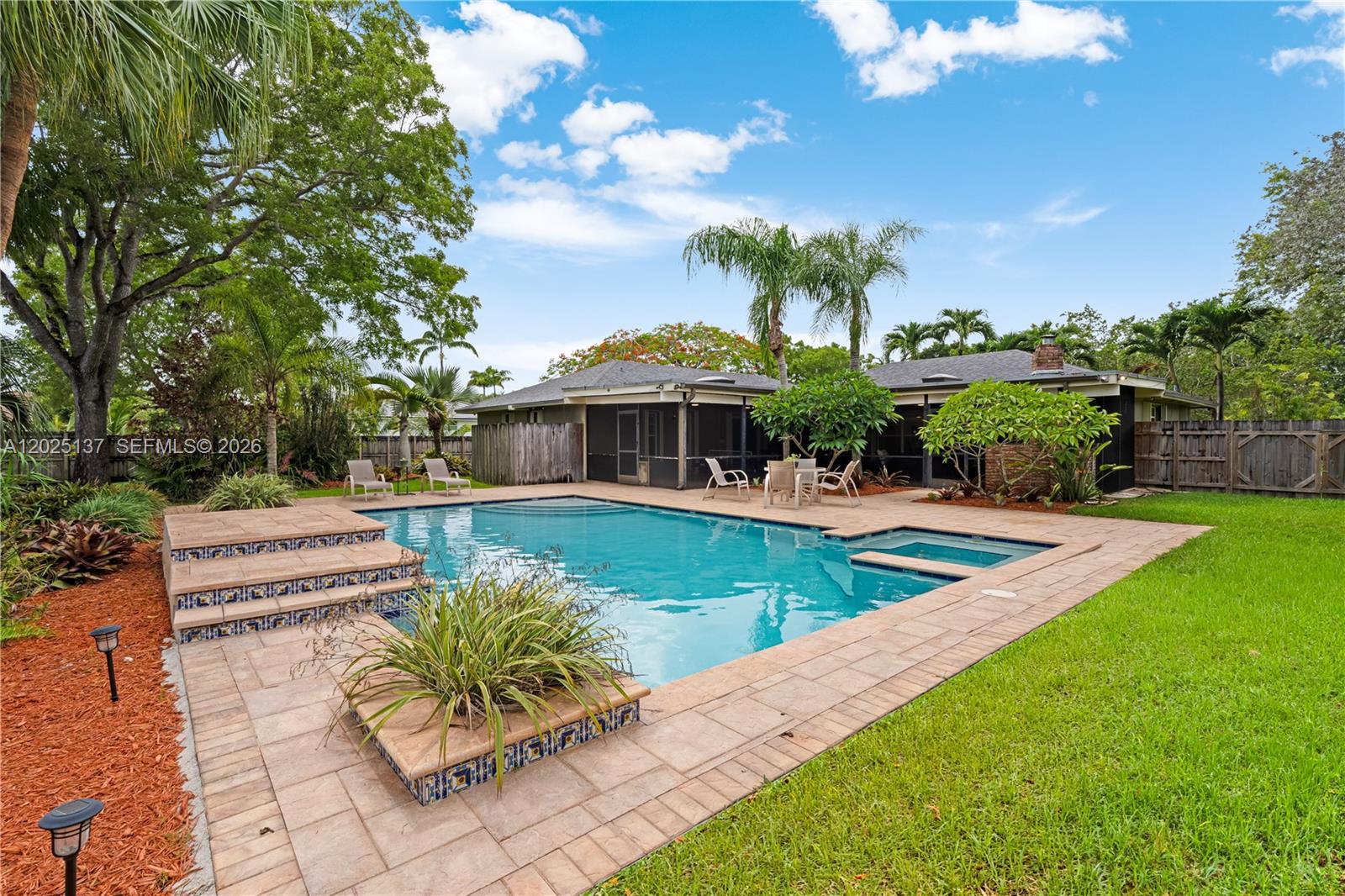 11480 Southwest 96th Terrace Miami, FL 33176 - Photo 49 of 54 a view of a house with swimming pool and sitting area