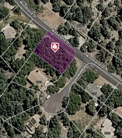 an aerial view of a red and white house