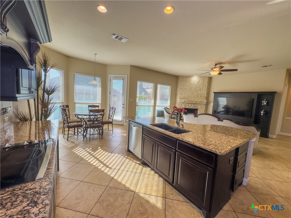 809 Alpino Cibolo, TX 78108 - Photo 11 of 29 a kitchen with counter top space and living room view