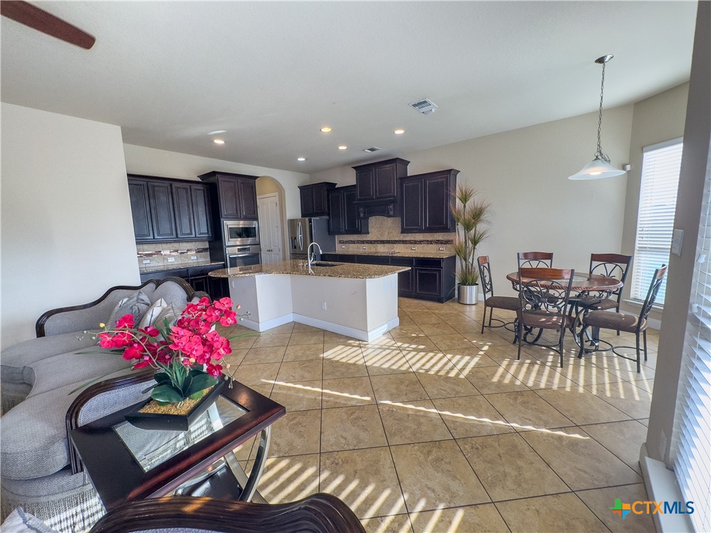 809 Alpino Cibolo, TX 78108 - Photo 12 of 29 a kitchen with a table and chairs