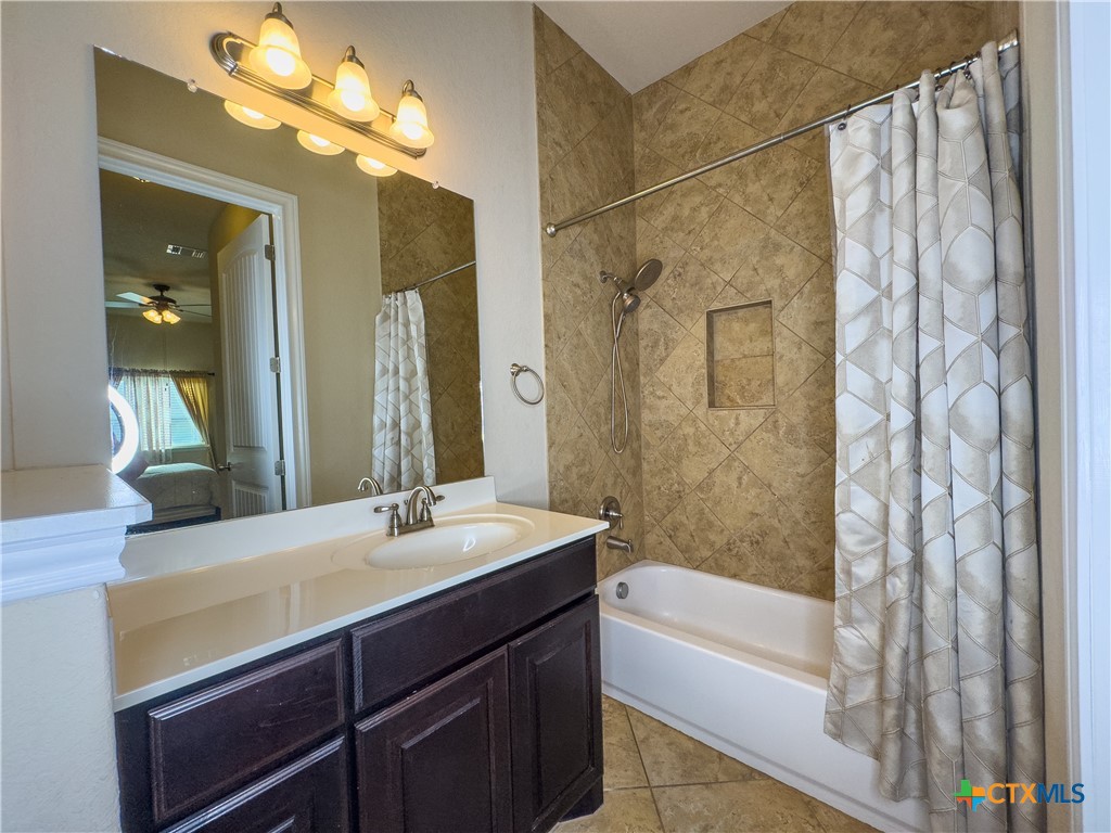 809 Alpino Cibolo, TX 78108 - Photo 17 of 29 a bathroom with a sink a bathtub and a mirror