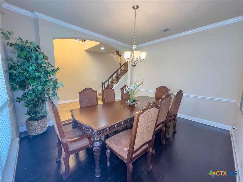 809 Alpino Cibolo, TX 78108 - Photo 19 of 29 a view of a dining room with furniture and chandelier