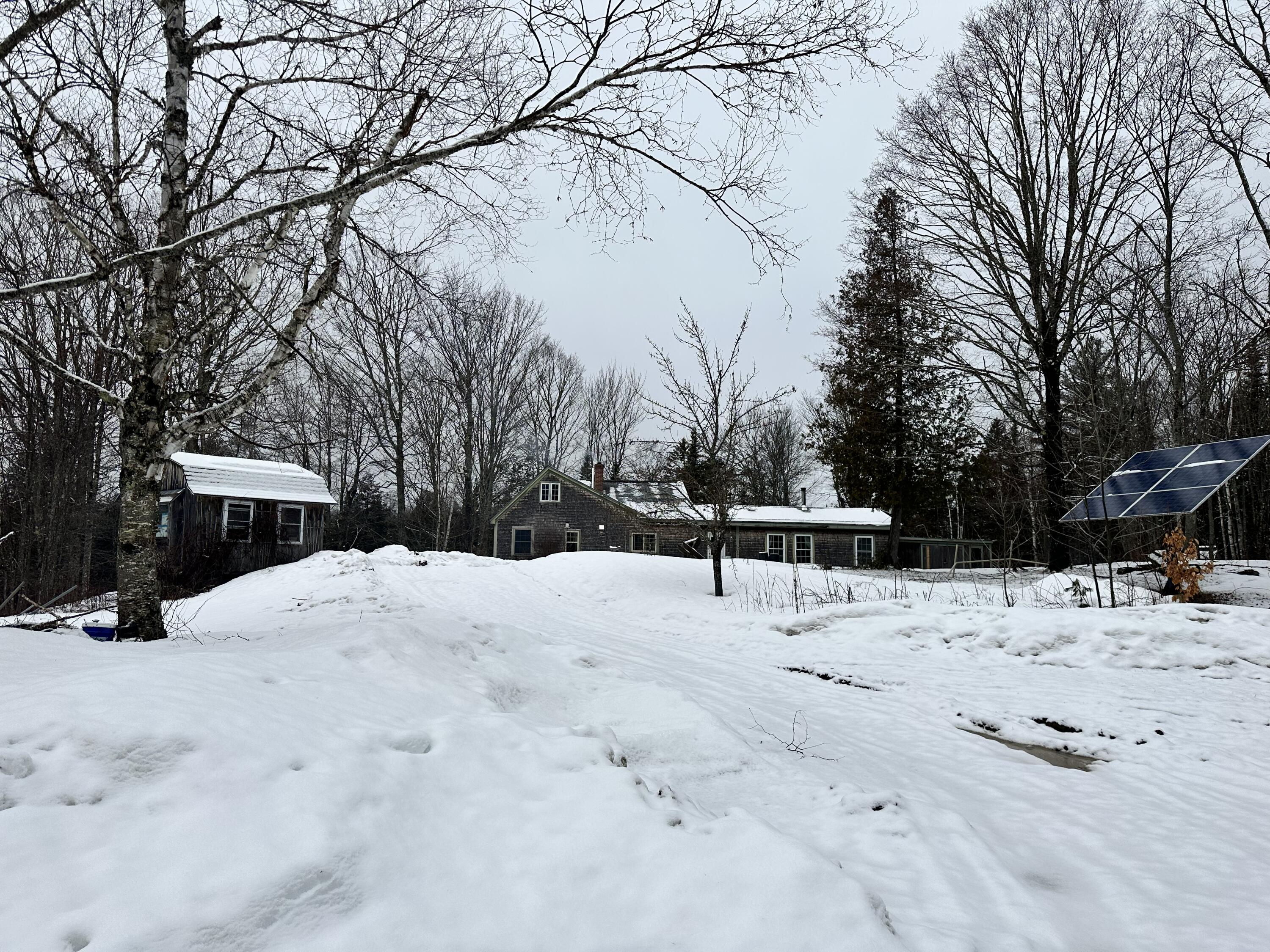 96 Webb Road Thorndike, ME 04986 - Photo 2 of 43 Solar array to right of driveway