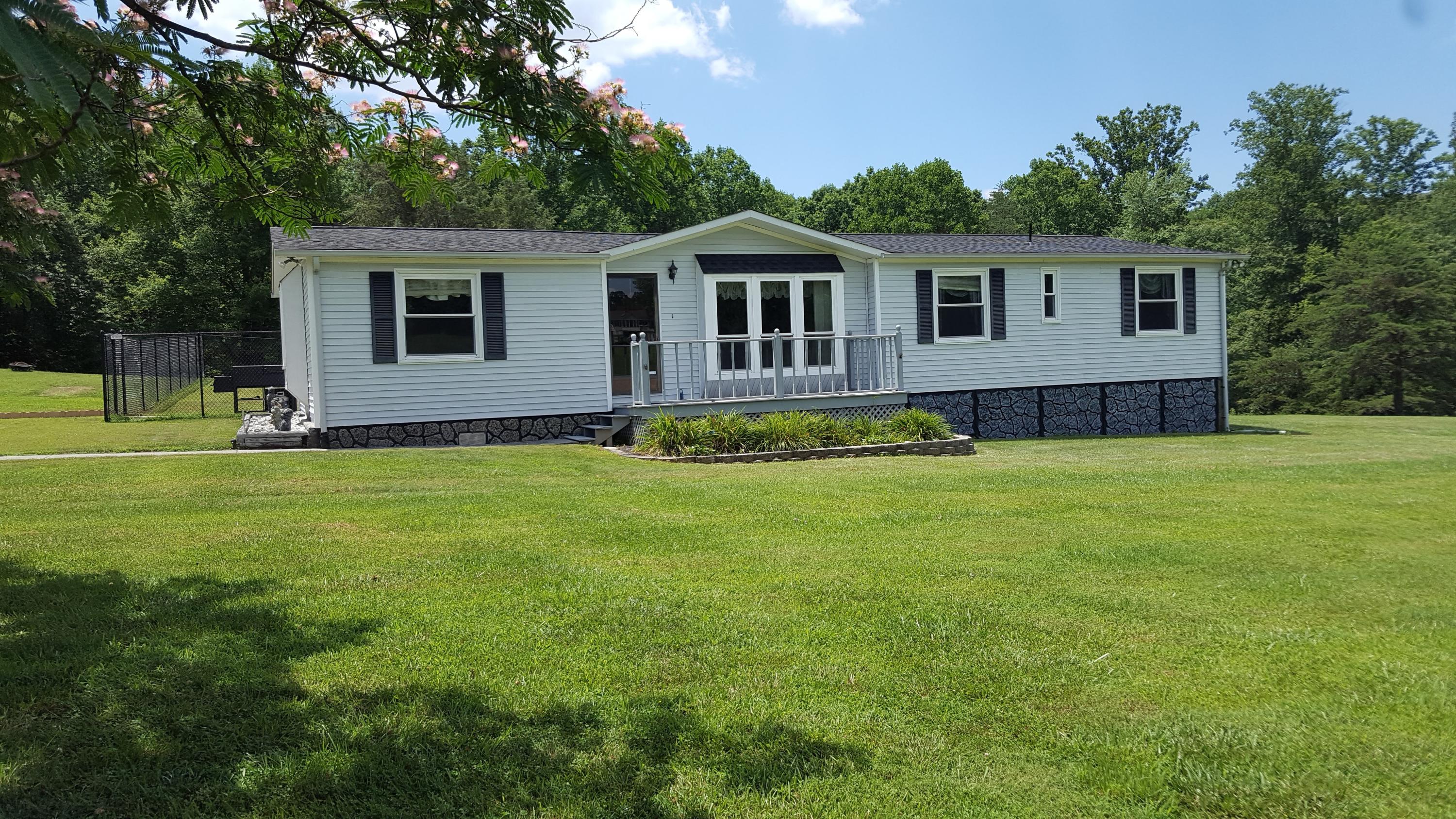 2771 Rutrough Road Southeast Roanoke, VA 24014 - Photo 1 of 31 a front view of house with yard and green space