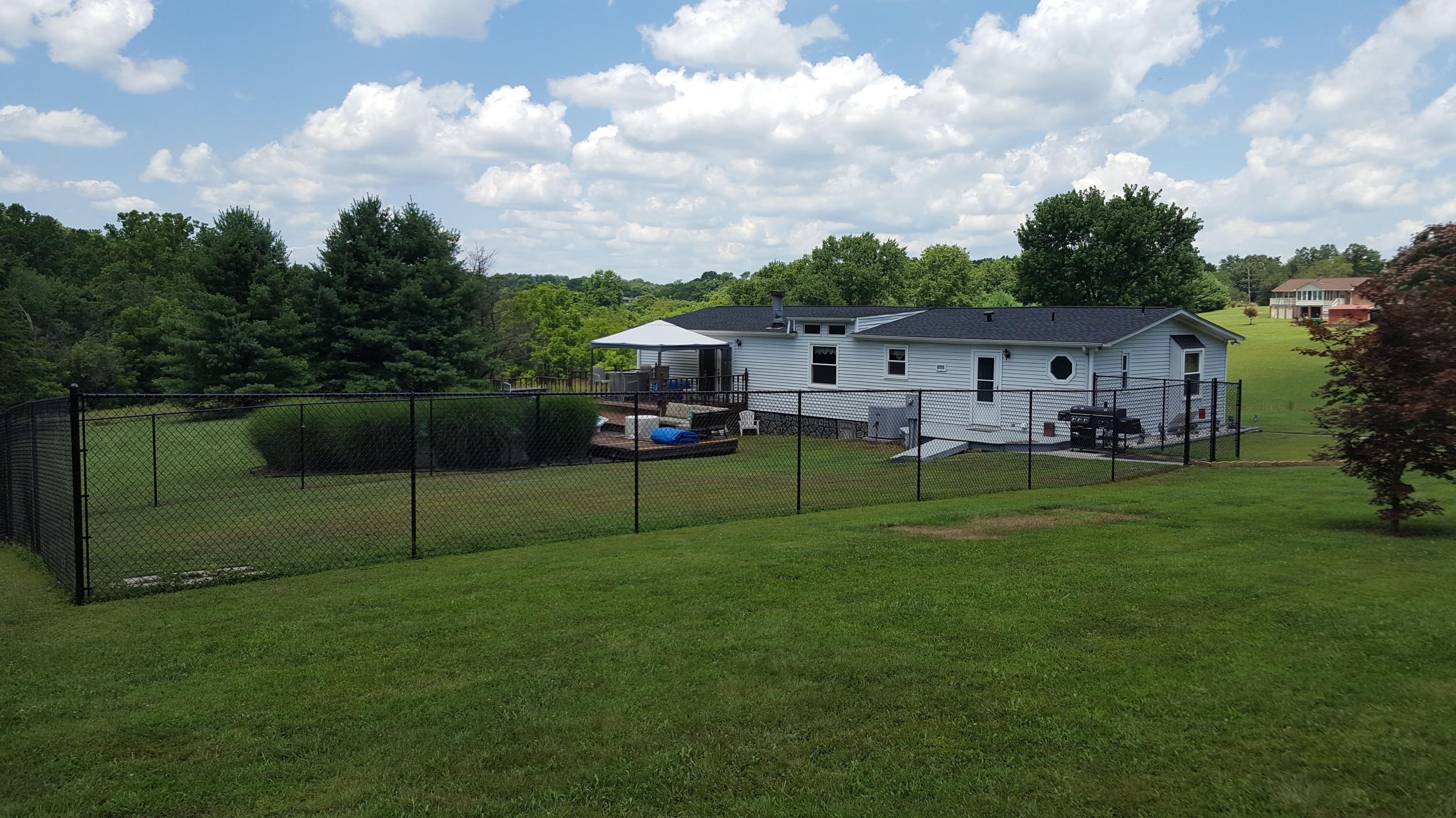 2771 Rutrough Road Southeast Roanoke, VA 24014 - Photo 2 of 31 a view of a house with a backyard